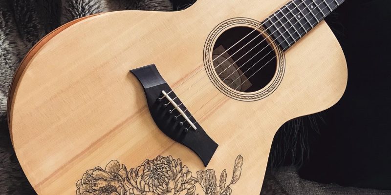Acoustic guitar with custom floral artwork